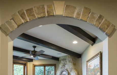basement-remodel-custom-stone-archway-detail Basement Remodel Custom Stone Archway Detail