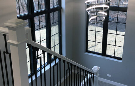 minnesota-custom-home-staircase-with-light-fixture Minnesota Custom Home Staircase with Light Fixture